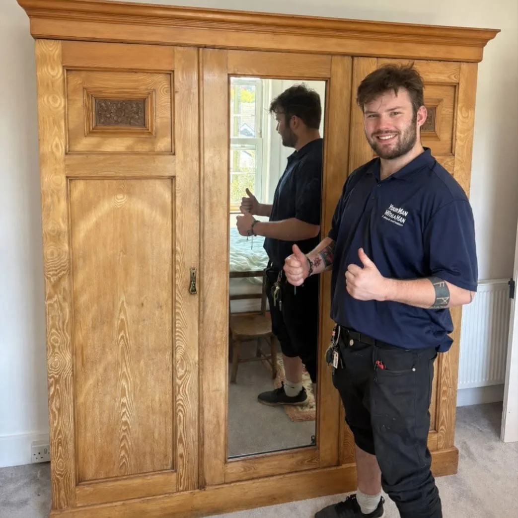 Your Man With A Van mover carefully handling an antique wardrobe during a house move